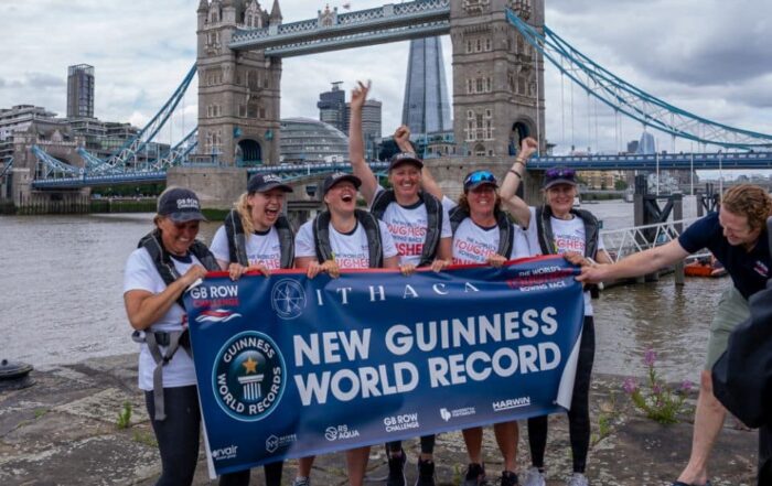 Six female rowers celebrating their world record