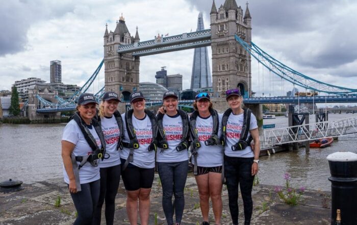 Team Ithaca on dry land after rowing around Great Britain