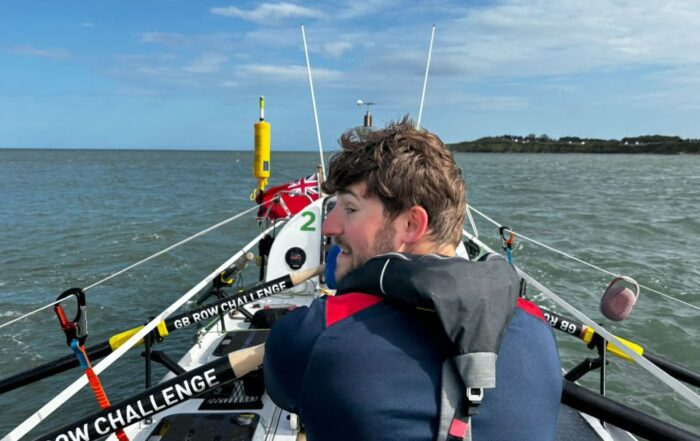 The back of one of the rowers rowing during the GB Row Challenge