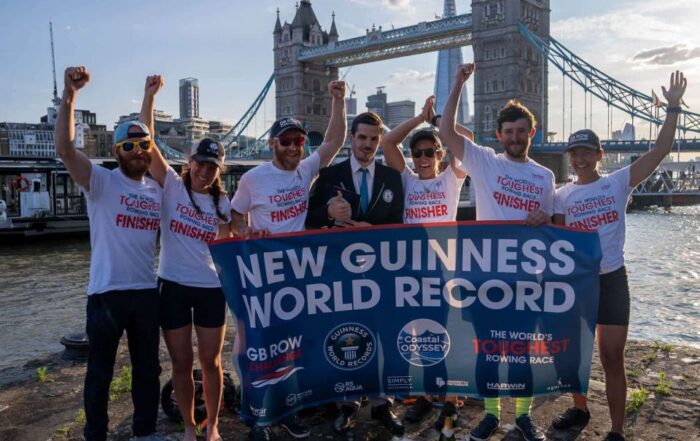 Team Coastal Odyssey in front of Tower Bridge London, after completing their record-breaking row around Great Britain