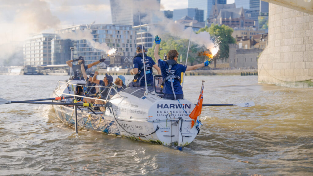 A rowing boat on the Thames as they finish the GB Row Challenge.