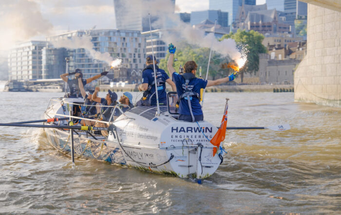 A rowing boat on the Thames as they finish the GB Row Challenge.