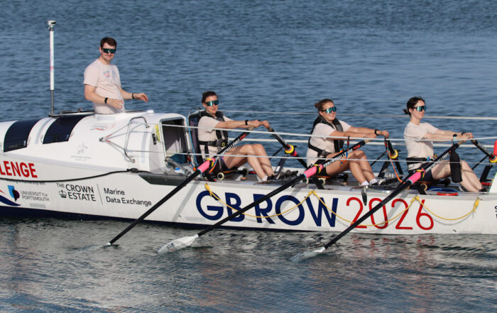 Team Nautilus rowing on the ocean
