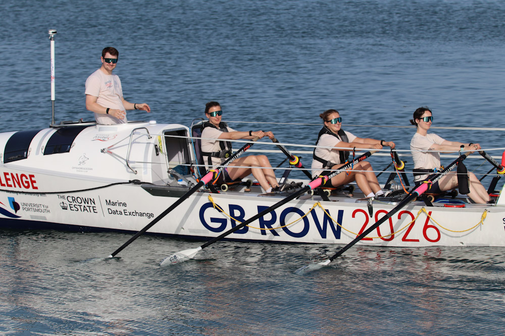 Team Nautilus rowing on the ocean
